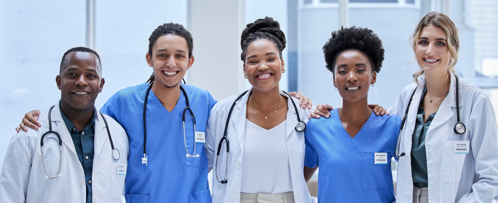 Smiling healthcare professionals standing together